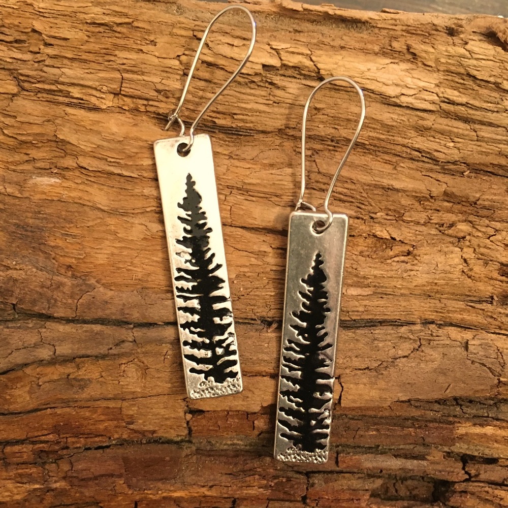 Long shiny metal treetop earrings